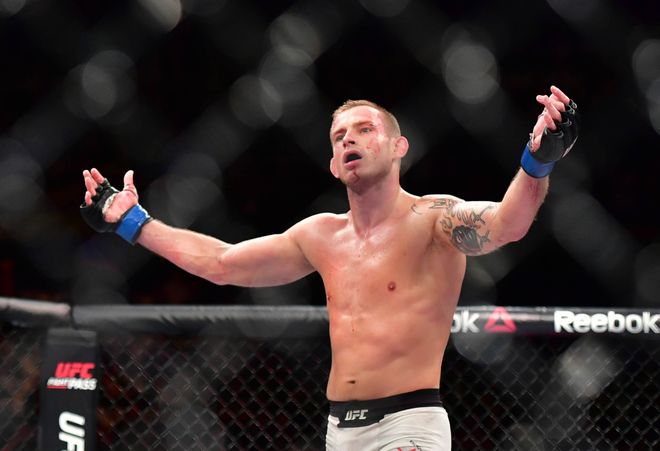 Nov 19, 2016; Sao Paulo, Brazil;   Krzysztof Jotko (blue gloves) defeats Thales Leites (red gloves) during UFC Fight Night at Ibirapuera Gymnasium. Mandatory Credit: Jason Silva-USA TODAY Sports