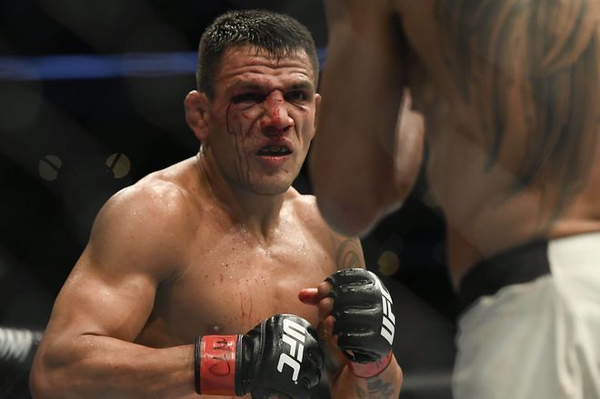 Nov 5, 2016; Mexico City, Mexico; Rafael Dos Anjos (red gloves) fights Tony Ferguson (blue gloves) during UFC Fight Night at Distrito Federal. Mandatory Credit: Etzel Espinosa-USA TODAY Sports