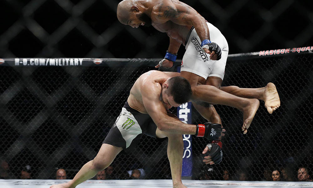 Nov 12, 2016; New York, NY, USA;    Yoel Romero (blue gloves) takes down and defeats Chris Weidman (red gloves) during UFC 205 at Madison Square Garden. Mandatory Credit: Adam Hunger-USA TODAY Sports